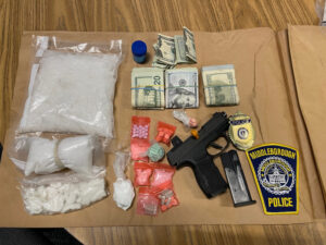 Middleborough Police seized more than 600 grams of crystal methamphetamine, more than 100 grams of cocaine, Percocet and Xanax pills, and a 9amm Sig Sauer pistol with a large-capacity feeding device during a raid on Saturday. (Courtesy Middleborough Police Department)